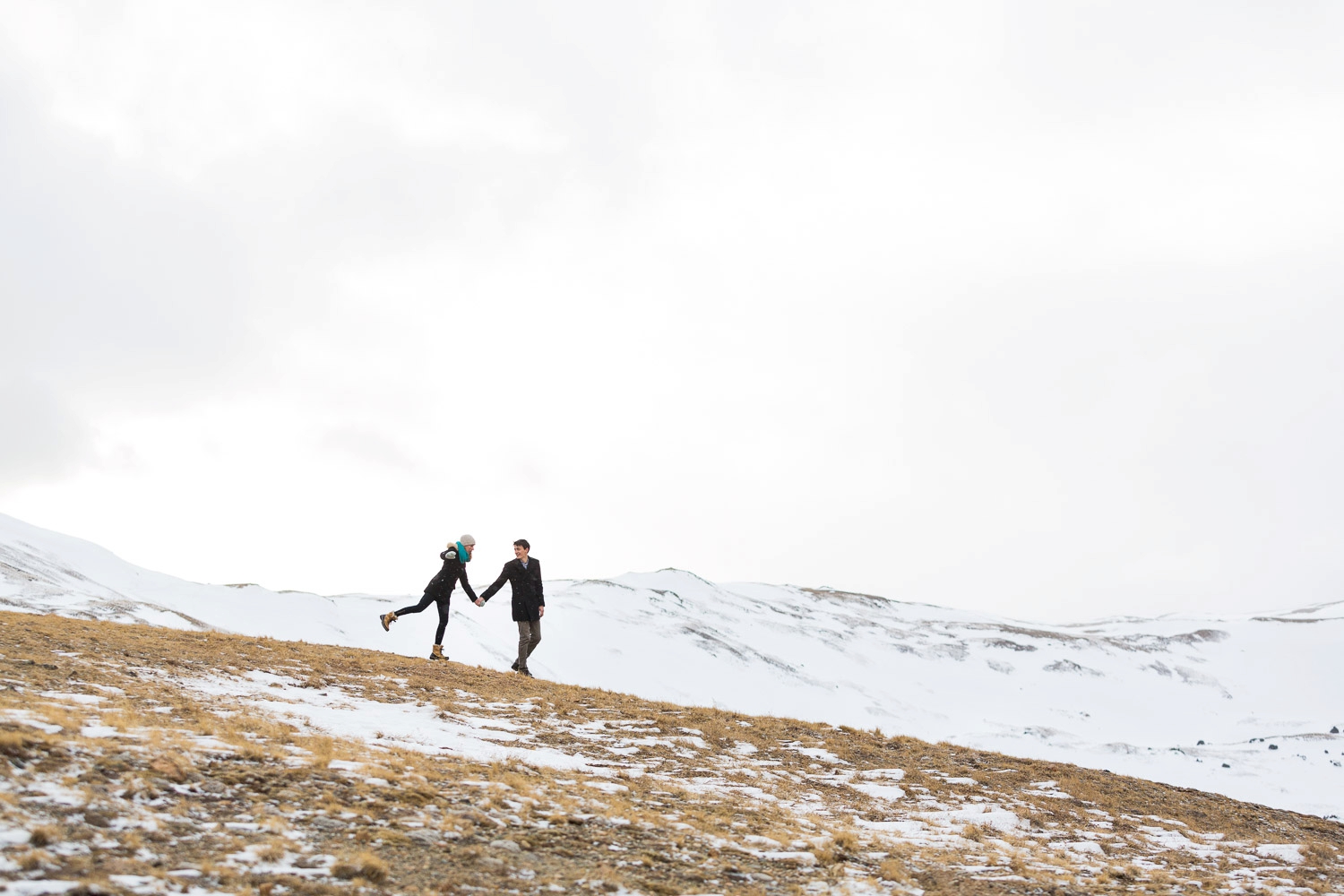 playful loveland pass colorado engagement photography in winter