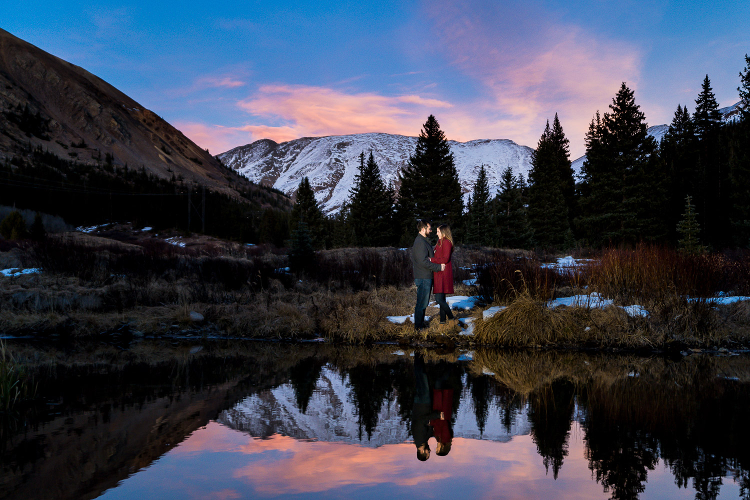 Colorado Mountain Engagement Photos with mountain backdrop in lake reflection