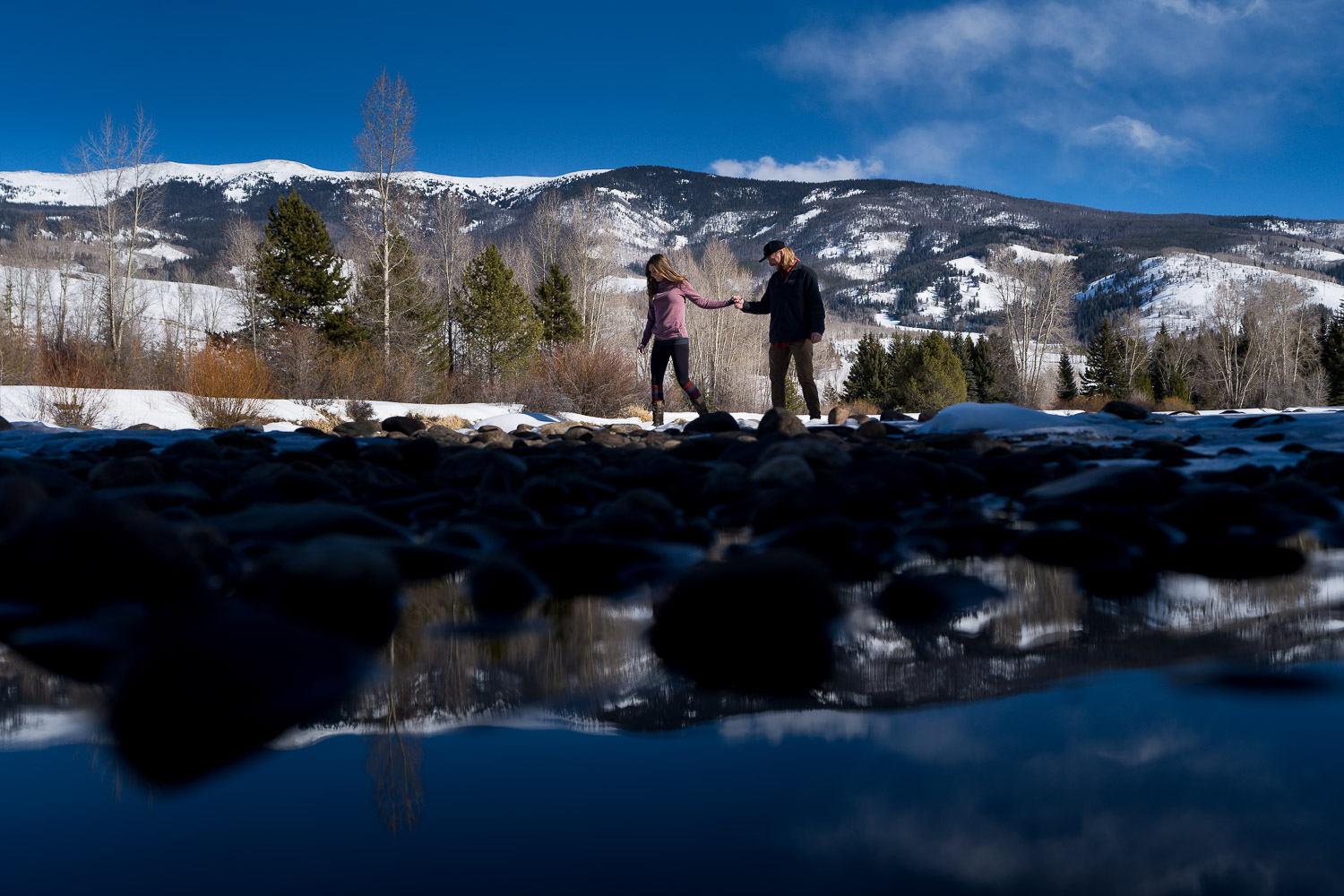 winter colorado engagement photos by river