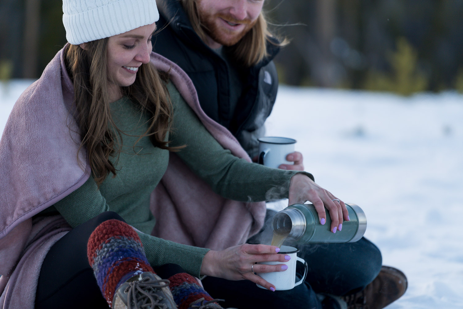 winter colorado engagement photos with hot drinks
