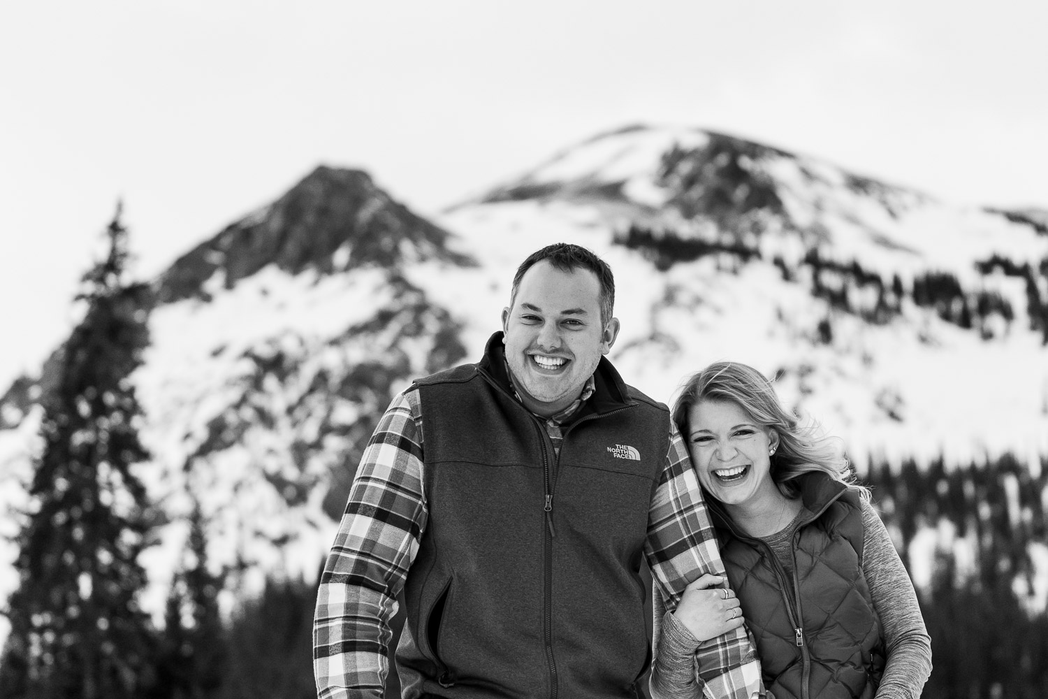 Winter Mountain Engagement Photos black and white laughing