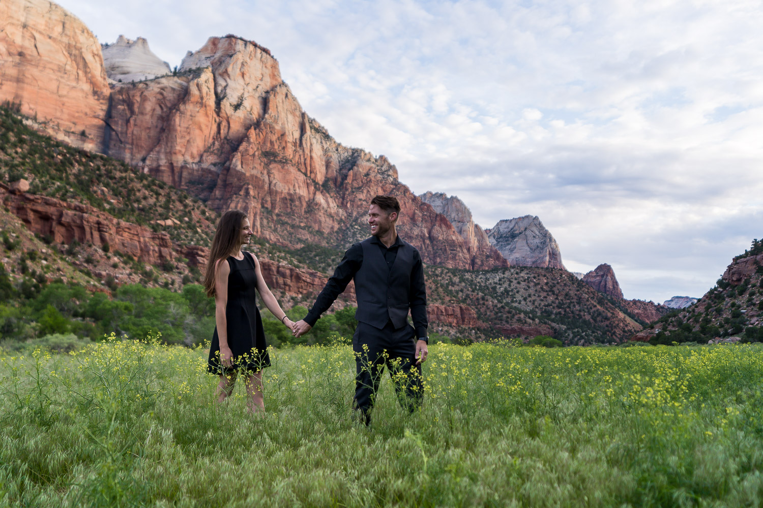 Zion National Park Engagement Photos with sunrise on red walls