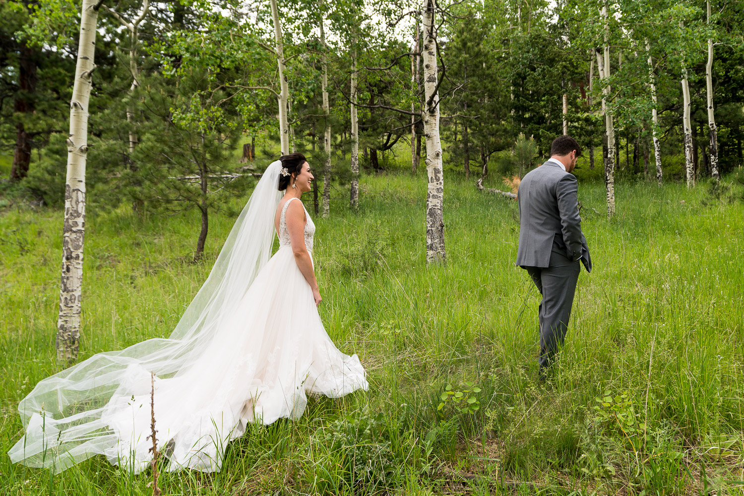 Evergreen Lake House Colorado Wedding Photos Bride and Groom in Forest