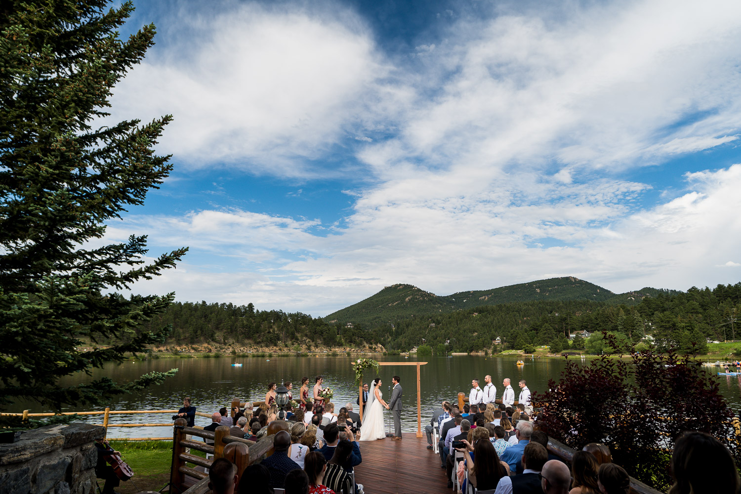 Evergreen Lake House Colorado Wedding Photos Bride and Groom by Lake