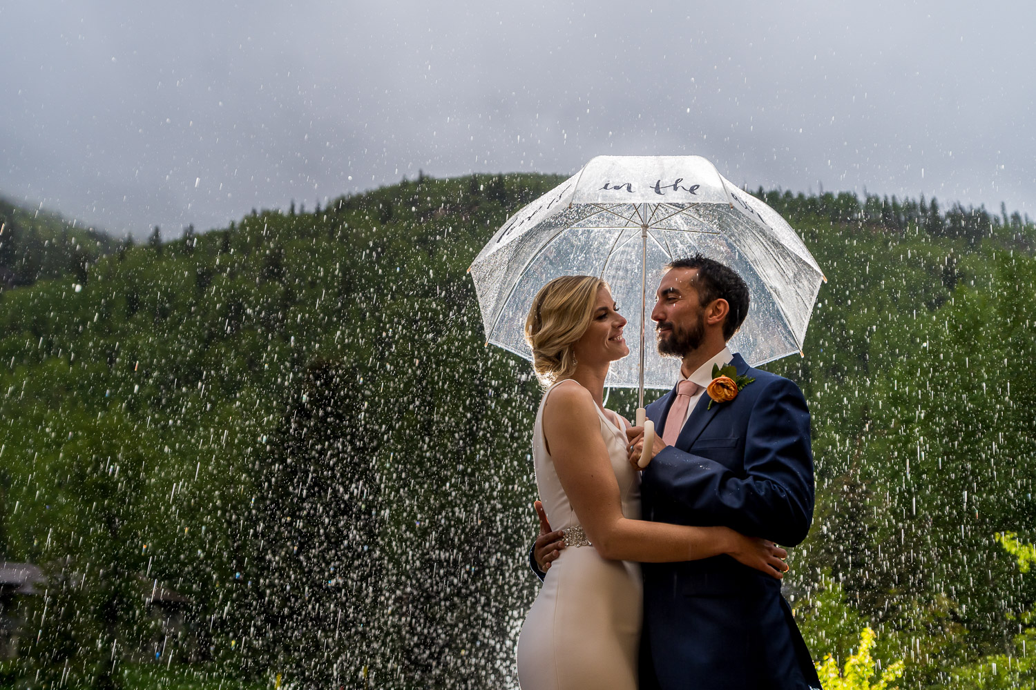 wedding photography in the rain umbrella and back light
