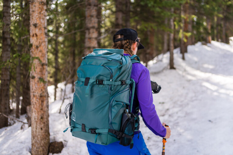 my favorite camera backpack for women shimoda action x v2 backpack on a skiing photoshoot