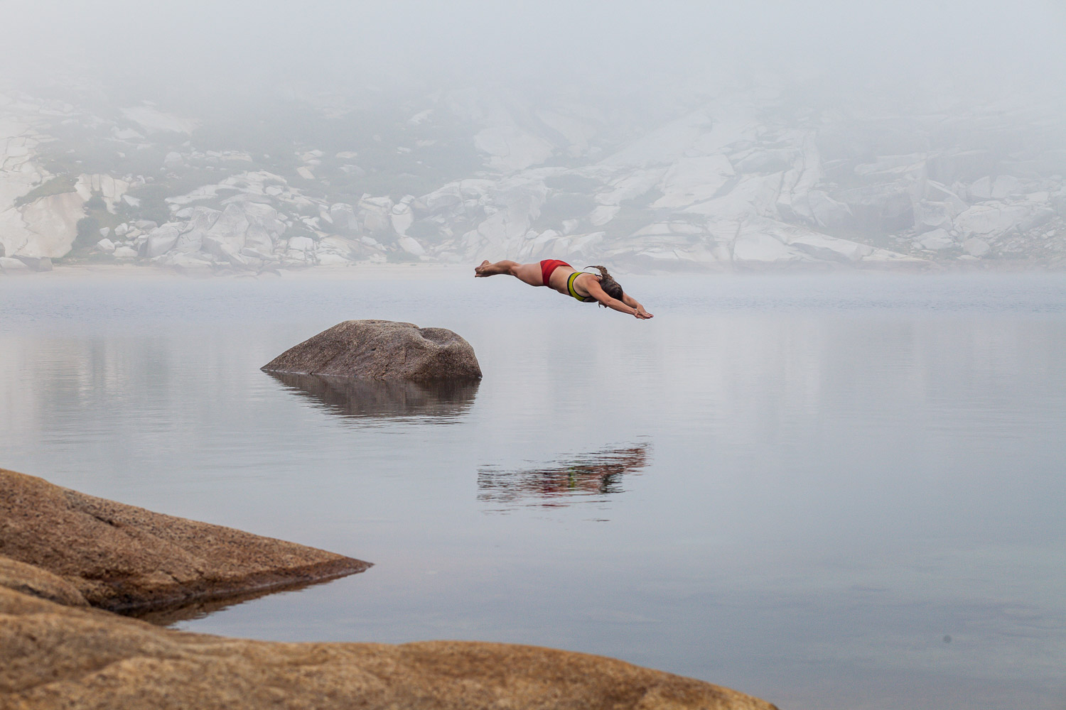 woman diving in alpine lake 85mm sample image