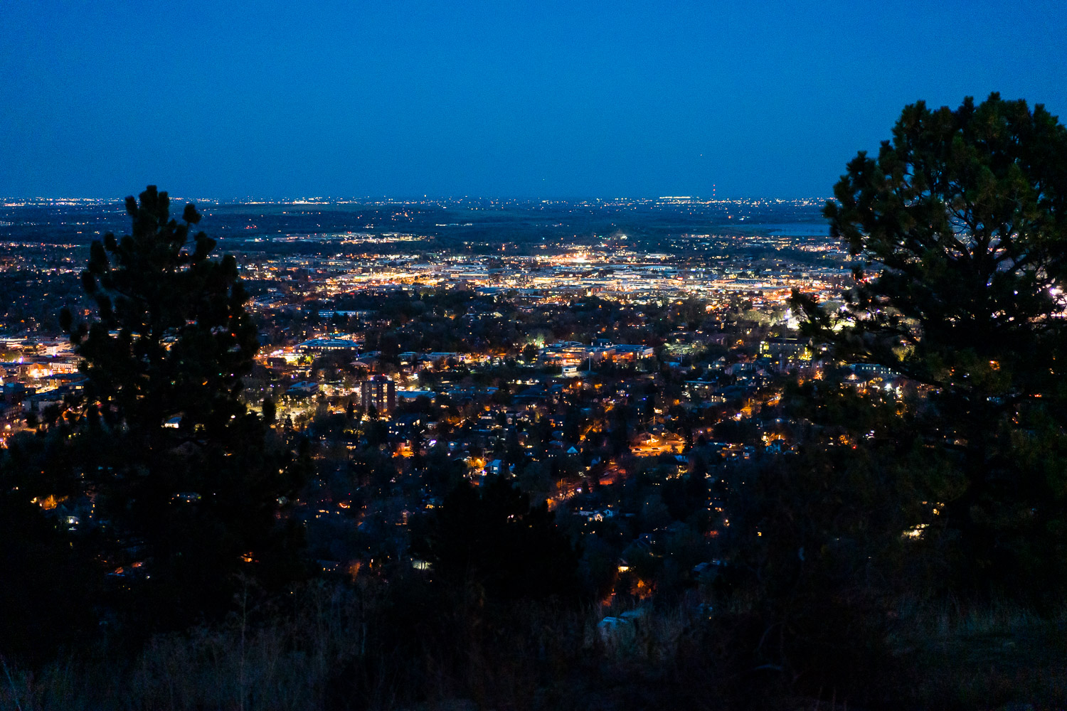nightime view of downtown boulder from flagstaff house wedding